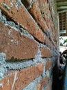 the surface of the red brick wall that has not been plastered Royalty Free Stock Photo