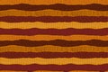 Textured orange and maroon stripes African seamless pattern