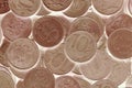 A surface of Russian coins of 10 rubles. Light brown tinted inverted background. Economy and the Central Bank of Russia. Money