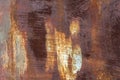 Surface of rusty iron with remnants of old paint texture background Royalty Free Stock Photo