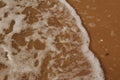 The surface of the sea on the sand, waves on the beach a Royalty Free Stock Photo