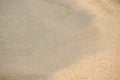The surface of the sea on the sand, waves on the beach a Royalty Free Stock Photo
