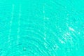 Surface of shining swimming pool water ripple in futuristic green toning. Royalty Free Stock Photo