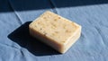 Surface. The soap appears rectangular with rounded edges and has an Royalty Free Stock Photo