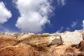 Stone wall decoration on blue sky and white cloud Royalty Free Stock Photo