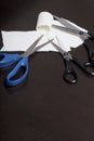 On the surface of the table are three pairs of scissors and a patch of excised tissue. Royalty Free Stock Photo