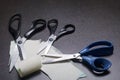 On the surface of the table are three pairs of scissors and a patch of excised tissue. Royalty Free Stock Photo