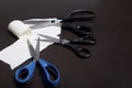 On the surface of the table are three pairs of scissors and a patch of excised tissue. Royalty Free Stock Photo
