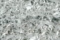 Surface texture of crumpled aluminum silver foil. Copy, empty space for text Royalty Free Stock Photo