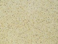Surface texture of light brown artificial stone. Royalty Free Stock Photo