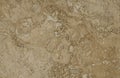 Surface of the travertine. Beige colour. Royalty Free Stock Photo