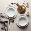 Surface. Two sets of white plates with bowls are accompanied by white-ha Royalty Free Stock Photo