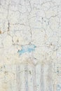 Surface of the wall with old damaged paint. Vertical background