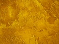 Surface of the wall is rough, paint in gold texture material background Royalty Free Stock Photo