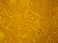 Surface of the wall is rough, paint in gold texture material background Royalty Free Stock Photo