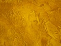 Surface of the wall is rough, paint in gold texture material background Royalty Free Stock Photo