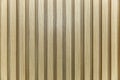 The surface of a yellow-brown wooden slatted panel. Decor and interior design, construction and renovation. Space for text Royalty Free Stock Photo