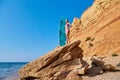 Surfboard for active sport. Lady sunbathing on stone. Idea of surfing, summer, vacation trip and relax time, copy space Royalty Free Stock Photo