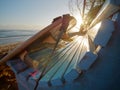 Surfboard on a blue bench near the ocean. Royalty Free Stock Photo