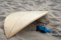 Surfboard lying on beach