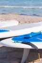 Surfboards on shoreline of sand Royalty Free Stock Photo