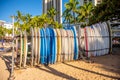 Surfboards on Waikiki Beach standing in a rack