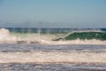 Surfer in a barrel falling under the force of the waves