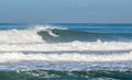 Surfer in a barrel falling under the force of the waves