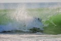 Surfer in a barrel falling under the force of the waves