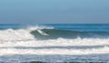 Surfer in a barrel falling under the force of the waves