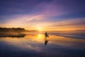 Surfer in the beach at sunset Royalty Free Stock Photo