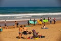 Surfer beach of Zarautz with people learning to surf