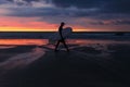 Surfer black silhouette at sunset