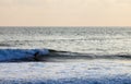 Surfer on Blue Ocean Wave in Bali Royalty Free Stock Photo