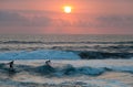 Surfer on Blue Ocean Wave in Bali Royalty Free Stock Photo