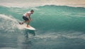 Surfer on Blue Ocean Wave, Bali, Indonesia. Riding in tube. Royalty Free Stock Photo