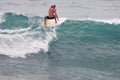 Surfer on Blue Ocean Wave, Bali, Indonesia. Riding in tube. Royalty Free Stock Photo