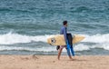 Surfer with board and wet suit Royalty Free Stock Photo