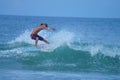 Surfer Boy Carving a Wave in the Outer Banks of NC Royalty Free Stock Photo