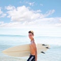 Surfer boy teenager with surfboard in beach Royalty Free Stock Photo