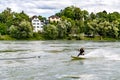 Surfer bungee surfing on the Rhine River in Bad Saeckingen
