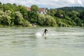 Surfer bungee surfing on the Rhine River in Bad Saeckingen