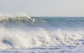 Surfer catching a large wave