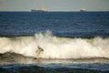 A surfer catching a wave, Durban