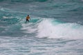 Surfer catching a wave at Ho`okipa Hawaii