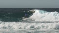 Surfer doing several cutbacks on a gold coast wave