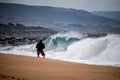 Surfer Dropping in at the fabled Wedge in Newport Beach