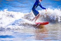 Surfer dude on a surfboard riding ocean wave Royalty Free Stock Photo