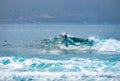 Surfer at el Confital beach along the city of Las Palmas de Gran Canaria, Spain