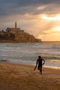 Surfer Emerging at Sunset - Old Jaffa, Israel - Mediterranean